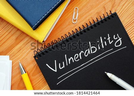 Vulnerability is written in white pencil on a black page.