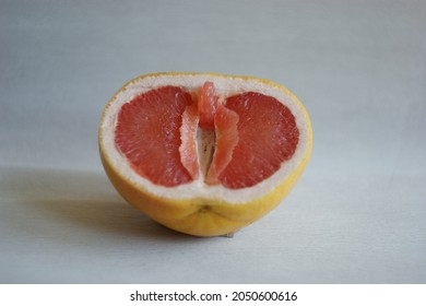 vulva, clitoris and labia symbol. Grapefruit looks like a vulva (vagina), with the clitoris and labia. Female genitalia concept