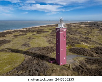 Vuurtoren lighthouse in the 
dutch coasts (Nederland) from drone view - Powered by Shutterstock