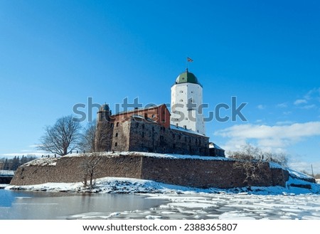Vyborg Castle
Beautiful view of Vyborg Castle on a sunny winter day. The main tower of St. Olaf is illuminated by bright rays of the sun. 
Vyborg, Leningrad Region, Russia,