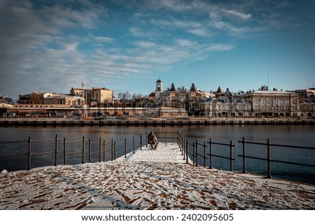 Vyborg. Leningrad region. Fisherman on the shore of Vyboog Bay. Winter.