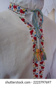 Vyshyvanka - Ukrainian National Outfit. Embroidered Shirt, Charm, Talisman,  Handmade Cross Stitch, Floral Ornament, Ukrainian Culture. Man Shirt, Blur And Selective Focus