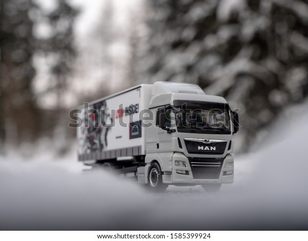 VYSOKE TATRY, SLOVAKIA - DECEMBER 10 2019: Truck\
scale model MAN TGX on the snowyroad. Scale model 1:87. Winter on\
the road. Truck on snowy\
road.