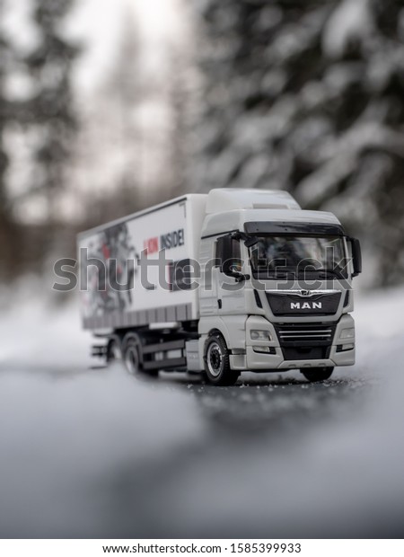 VYSOKE TATRY, SLOVAKIA - DECEMBER 10 2019: Truck\
scale model MAN TGX on the snowyroad. Scale model 1:87. Winter on\
the road. Truck on snowy\
road.