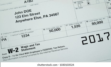 W2 Tax Form Copy B 2017 For Man Person John Doe With American Usa Flag. Wage And Tax Statement