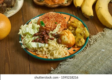Waakye, Ghanaian cuisine, cooked rice and beans,  mixed with  boiled eggs, stewed meat. Traditional assorted African dishes, Top view.