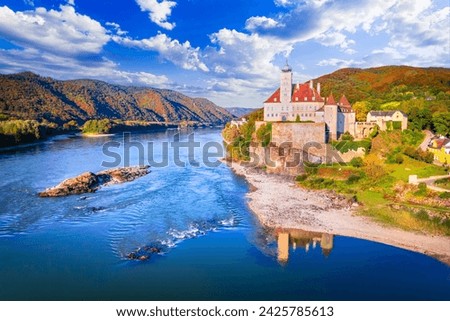 Wachau Valley, Austria. Small castle Schonbuhel above the Danube River in the romantic autumn sunlight, Lower Austria.