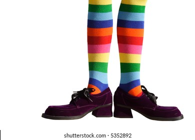 Wacky Clown Feet With Crazy Striped Socks And Oversized Purple Suede Shoes!  Isolated.