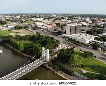 Waco, TX / USA - June 26 2019: Aerial view of the Waco Bridge over the Colorado River in Waco Texas