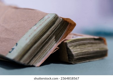 Wad of Argentine bills in envelope - Shutterstock ID 2364818567