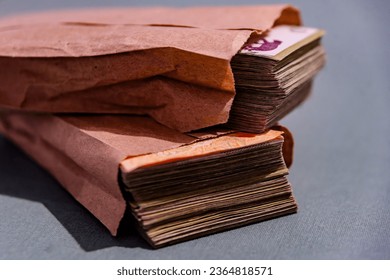 Wad of Argentine bills in envelope - Shutterstock ID 2364818571
