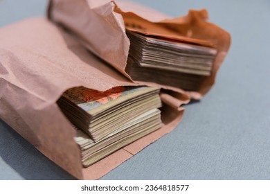 Wad of Argentine bills in envelope - Shutterstock ID 2364818577