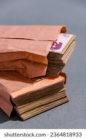 Wad of Argentine bills in envelope - Shutterstock ID 2364818933