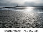 Wadden Sea in Cuxhaven Germany with the Kugelbake, a historic aid to navigation at the northernmost point of Lower Saxony, where the River Elbe flows into the North Sea.