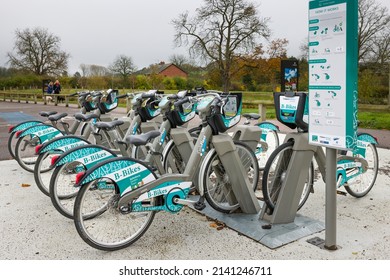 WADDESDON, UK - November 11, 2021. Row Of Electric Bikes, E-bikes At A Charging Station. Electrical Ebike Hire, Rental.