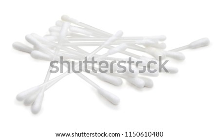 Wadding sticks for cleaning ears. Isolated on white background. Small heap of wadding sticks. Hygienic tools in bathroom. Cotton swabs on white. Plastic cotton buds, white bg. 