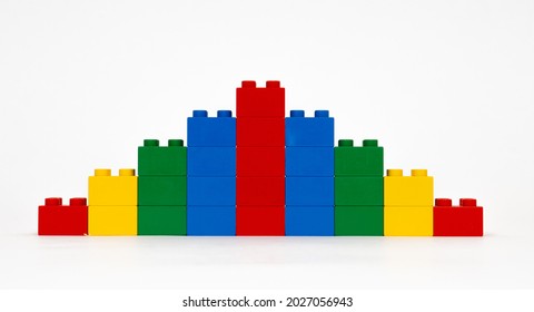 Waddinxveen, Netherlands, April 2021, Yellow, Blue, Red And Green Lego Duplo Blocks Stacked From 1 To 5 And Again To 1 With A White Background.