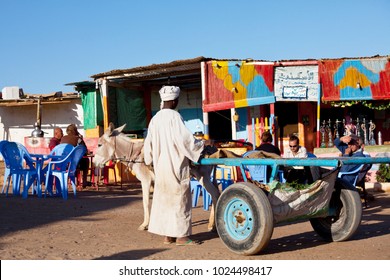 WADI HALFA, SUDAN - JANUARY 07: Sudanese Peasant Cookes The Babecue On January 07, 2010 In Border Town Wadi Halfa. Sudan Remains One Of The Least Developed Countries In The World.