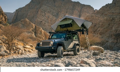 Wadi Naqab, United Arab Emirates - 08/15/2020: Camping with a rooftop tent