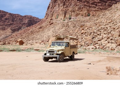 WADI RUM DESERT, JORDAN- APRIL 10, 2014: Mountains of Wadi Rum Desert also known as Valley of the Moon is a valley cut into the sandstone and granite rock in southern Jordan 60 km to the east of Aqaba - Shutterstock ID 255266809