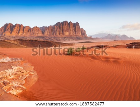 Wadi Rum Desert, Jordan. The red desert and Jabal Al Qattar mountain.