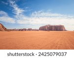 Wadi Rum, Jordan. A beautiful vibrant blue and orange landscape, Arabian desert, a dystopian martian scene with unique rock formations and dunes. Backdrop for graphic resource or copy space no peo