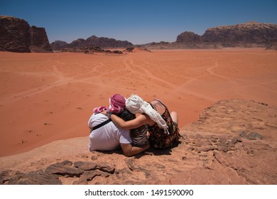 Wadi Rum, Jordan, July 20, 2019, Happy Family Enjoying Great View In Desert Wadi Rum