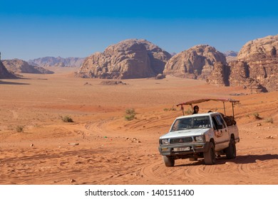 Wadi Rum, Jordan - May, 15, 2019: Bedouin's car jeeps and tourists, Wadi Rum desert in Jordan, Middle East. - Shutterstock ID 1401511400