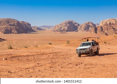 Wadi Rum, Jordan - May, 15, 2019: Bedouin's car jeeps and tourists, Wadi Rum desert in Jordan, Middle East. - Shutterstock ID 1401511412