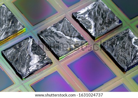A wafer is a thin slice of semiconductor material, such as a crystalline silicon, used in electronics for the fabrication of integrated circuits.Selective focus on pieces.