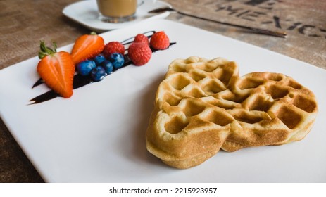 Waffel With Healthy Fruits Arranged On A White Plate