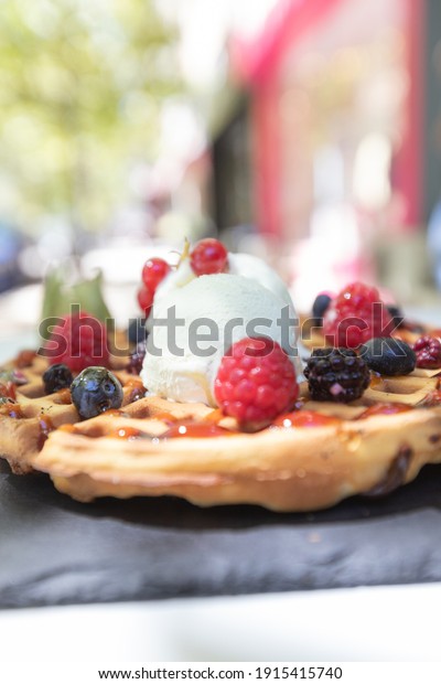 Waffle with berries and topping
