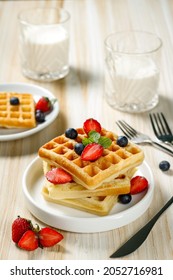 Waffle With Blueberry And Strawberry Topping For Breakfast Added With Fresh Milk