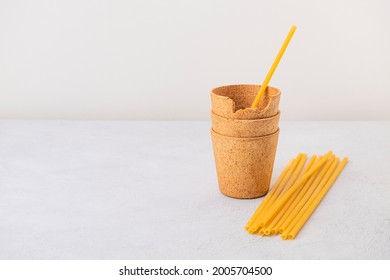 Waffle coffee cups and pasta straws on neutral background with copy space. Zero waste, plastic free, stop pollution, ecological concept - Shutterstock ID 2005704500