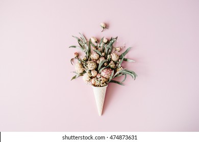 waffle cone with roses bouquet on pink background, flat lay, top view - Powered by Shutterstock