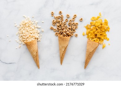 Waffle cones filled with various types of cereal. - Shutterstock ID 2176771029