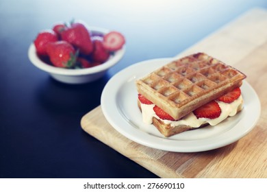 Waffle Sandwich With Caramel Ice Cream Dessert On White Plate With Strawberries 
