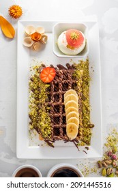 Waffle Sweets With Nutella, Banana And Strawberry Fruits	
