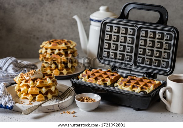 Waffles Being\
Baked in the Waffle Maker,\
square