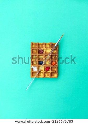 Waffles decorated like watercolor palette.
