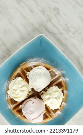 Waffles With Ice Cream And Whipped Butter On A Plate