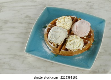 Waffles With Ice Cream And Whipped Butter On A Plate