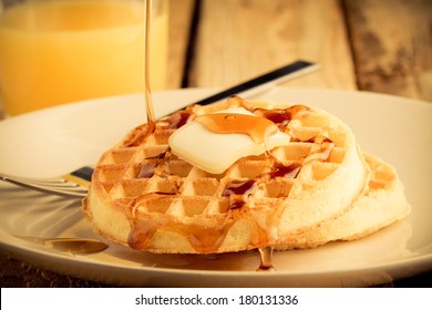 Waffles - This S A Photo Of A Couple Waffles Being Soaked In Syrup. Shot In A Warm Retro Color Tone With A Shallow Depth Of Field.