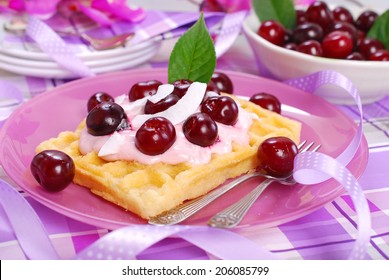 waffles with yogurt and fresh sour cherries for dessert  - Powered by Shutterstock