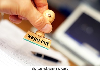 Wage Cut Concept With Stamp In Office Or Bureau Showing Financial Crisis