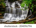 Wagner Falls crashes and cascades through the forest. Located south of Munising in Michigan