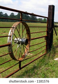 Wagon Wheel Gate Keywords: wagon, wheel, gate, hub, spokes, fence, post, farm, ranch, rustic, rusty, bars, rural, country, vintage