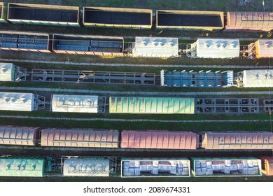 Wagons Of Freight Train Top Down Aerial View. Carriages On Railway Siding. Cargo Freighter Wagons