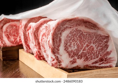 Wagyu beef with a beautiful red pattern. Cut into pieces.