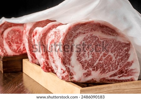 Wagyu beef with a beautiful red pattern. Cut into pieces.